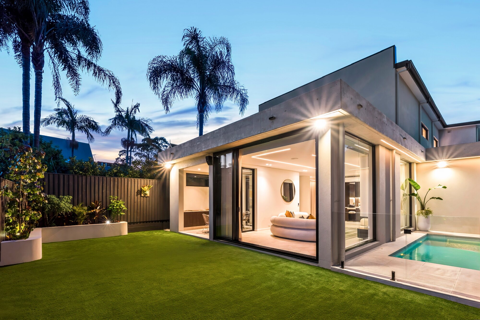 Landscaped backyard with pool, lawn and outdoor entertaining area